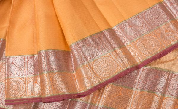 Yellow silksaree with zari buttas on its body,contrast violet border of  traditional designs & pallu of intricate designs